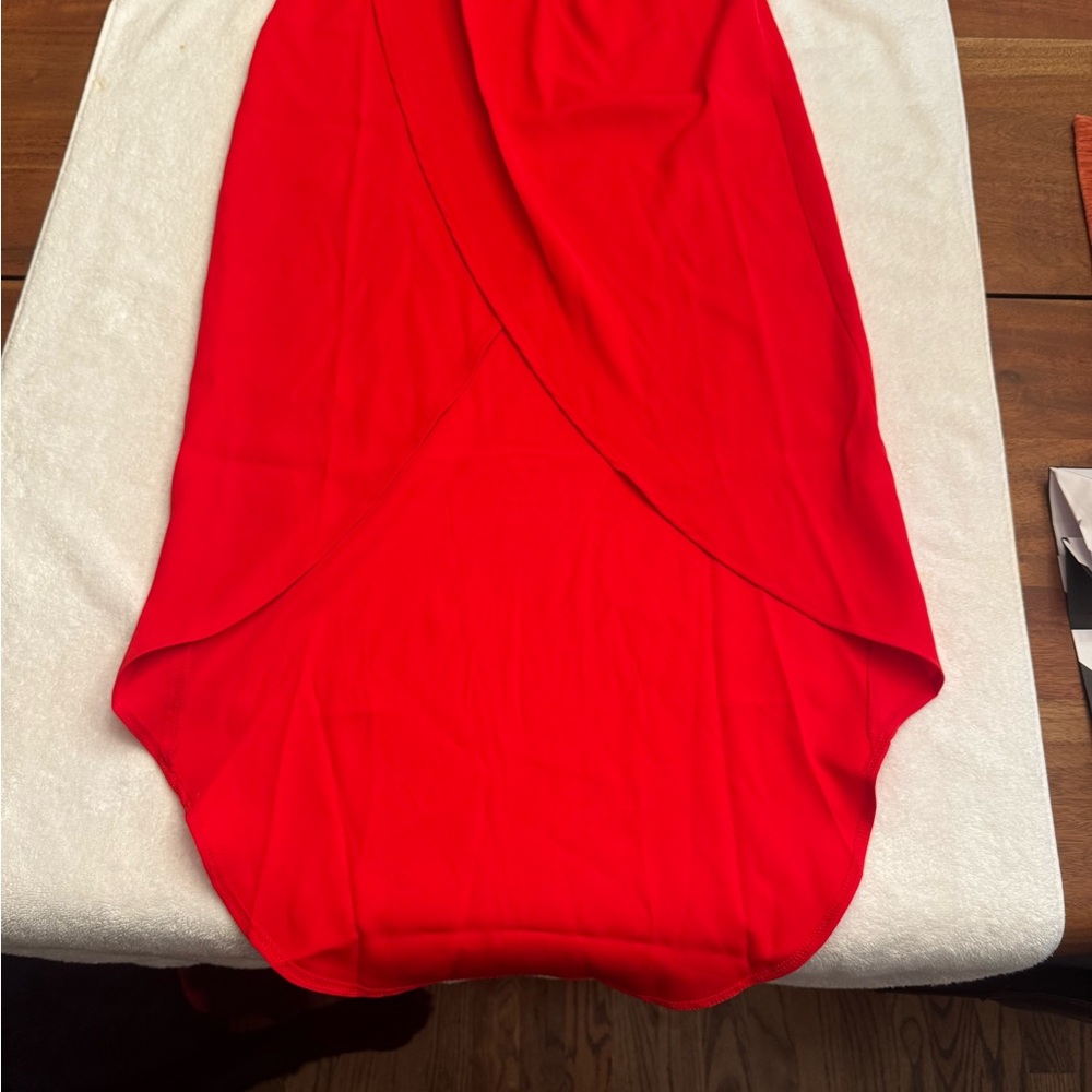 Super down by REVOLVE red, high/low skirt. 
Brand new with tags. Size M